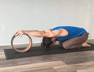 stretching with yoga wheel